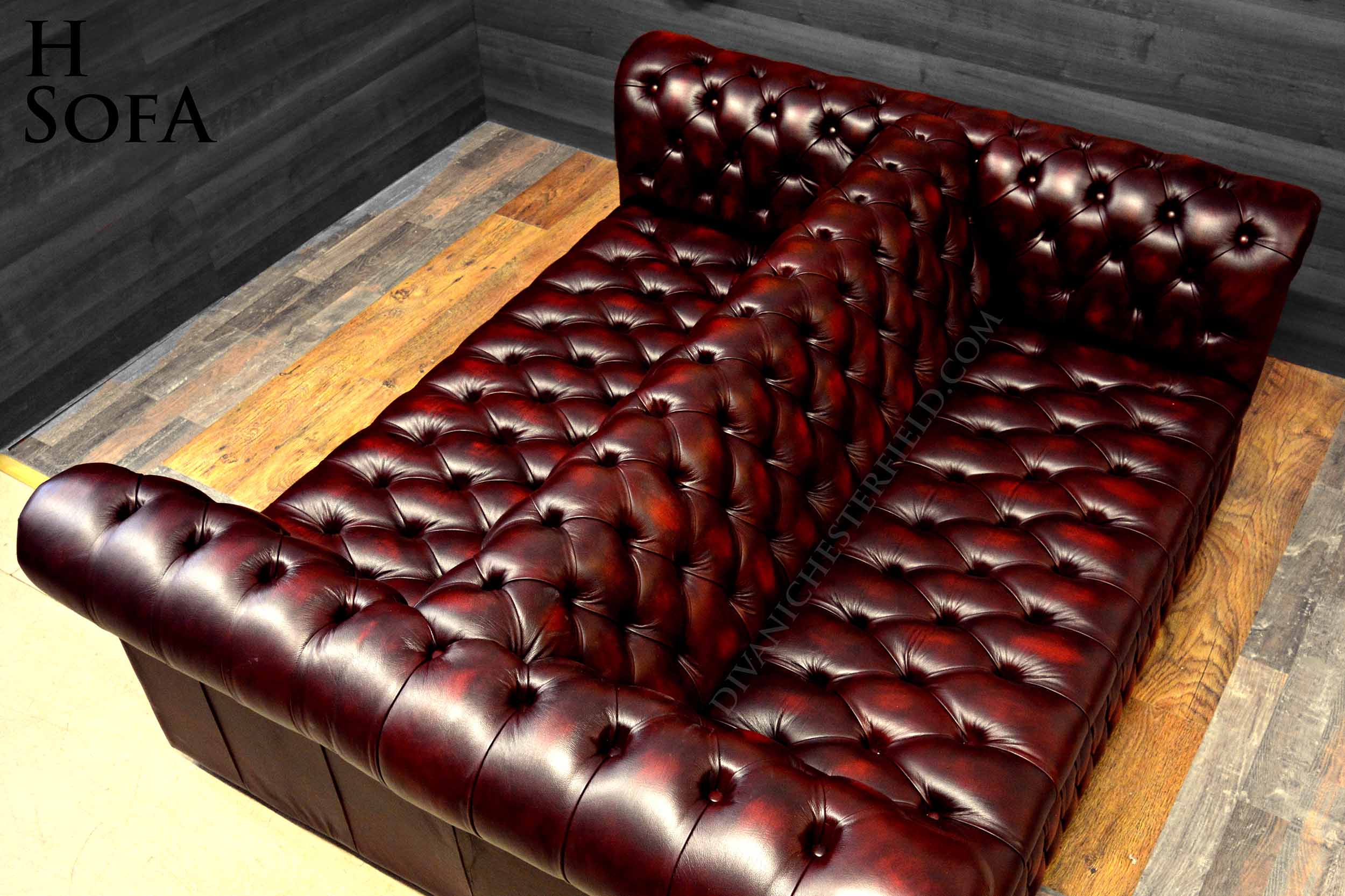 divano chesterfield pelle bordeaux bottoni seduta